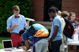 Andrew Vande Berg, '15, attracts prospective members to Disc Club. Photo by Emi Myers.